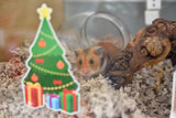 Hamster looking through glass tank at a Furnishables Christmas tree static cling sticker