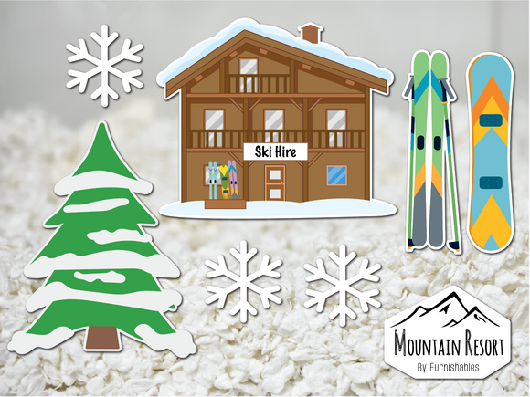 Mountain resort themed static cling stickers made by Furnishables stuck to the front of a glass pet habitat